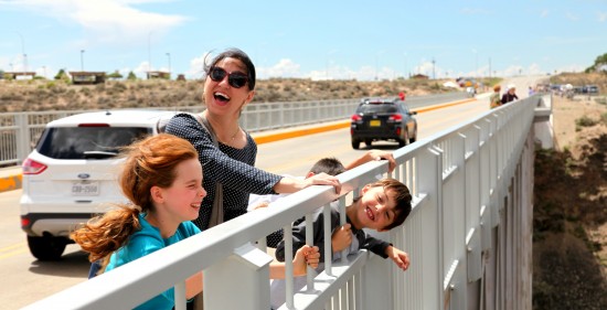 hanging onto the railing at Rio Grande Gorge bridge