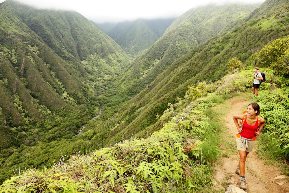 Hiking people on Hawaii, Waihee ridge trail, Maui, USA via Shutterstock