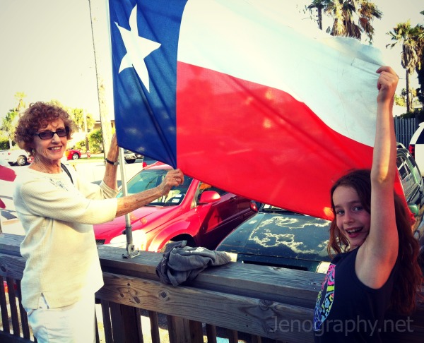 grandmother and girl with Texas flag