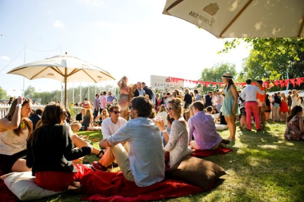 sitting on the grass at Polo in the Park