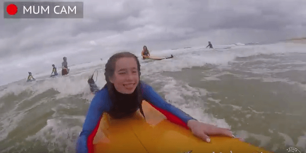 girl riding surfboard