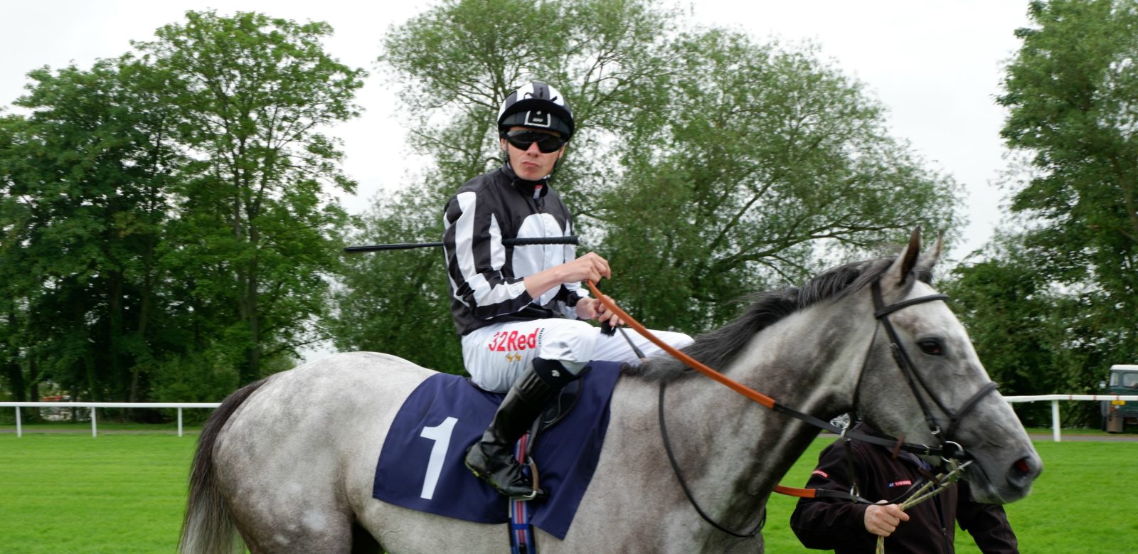 jockey on grey horse at Windsor