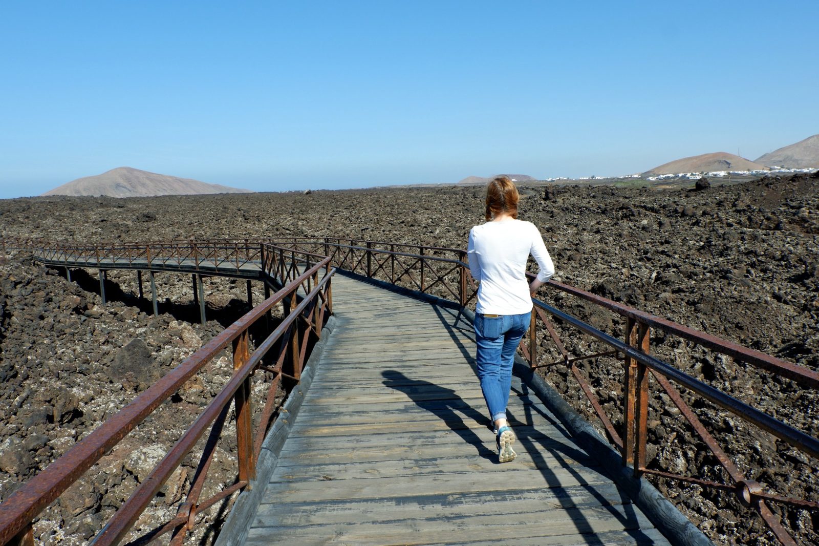 Timanfaya vicitors centre Jen walking over flows