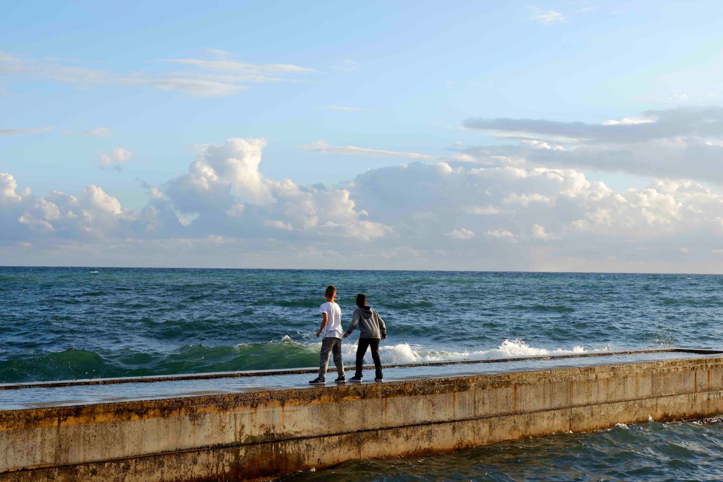 boys on pier in Paphos, Cyprus - Jenography